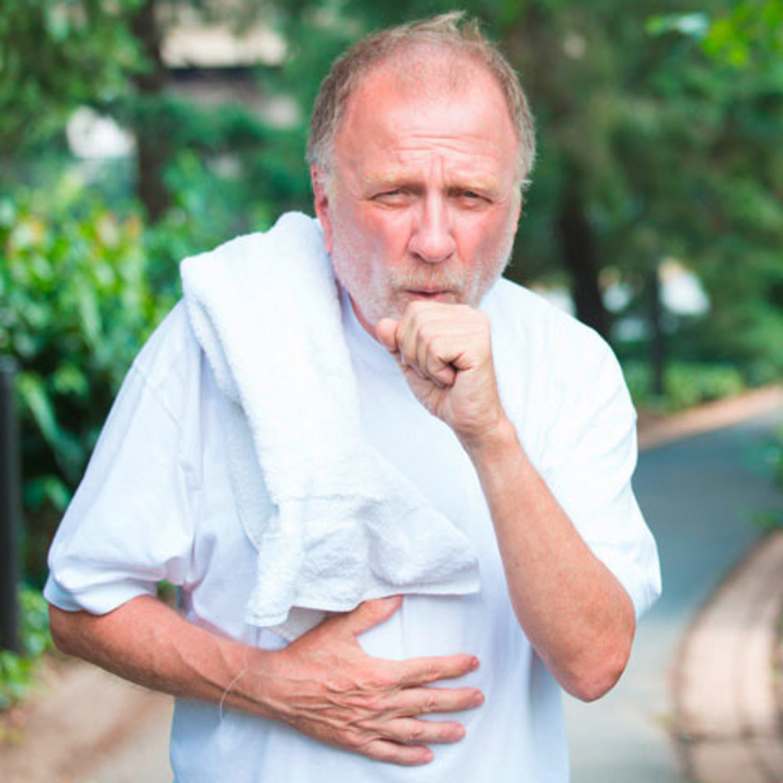 5 common problems in everyday life for COPD patients and how they can be solved Older man in sportswear coughs hard into his fist