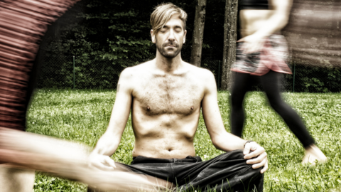 Nik Linder: Putting the fun into breathing A man is sitting cross-legged on a lawn with his eyes closed