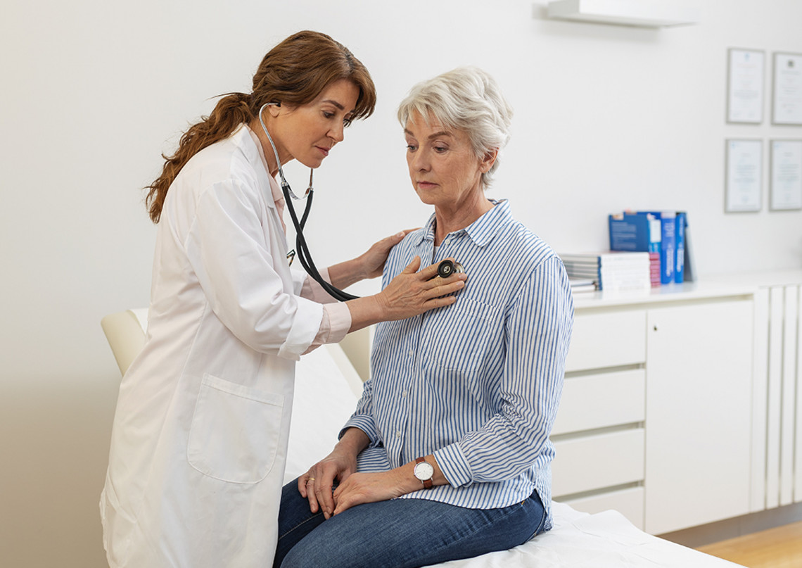 Diagnosis of COPD Healthcare professional speaking with an older person during a consultation
