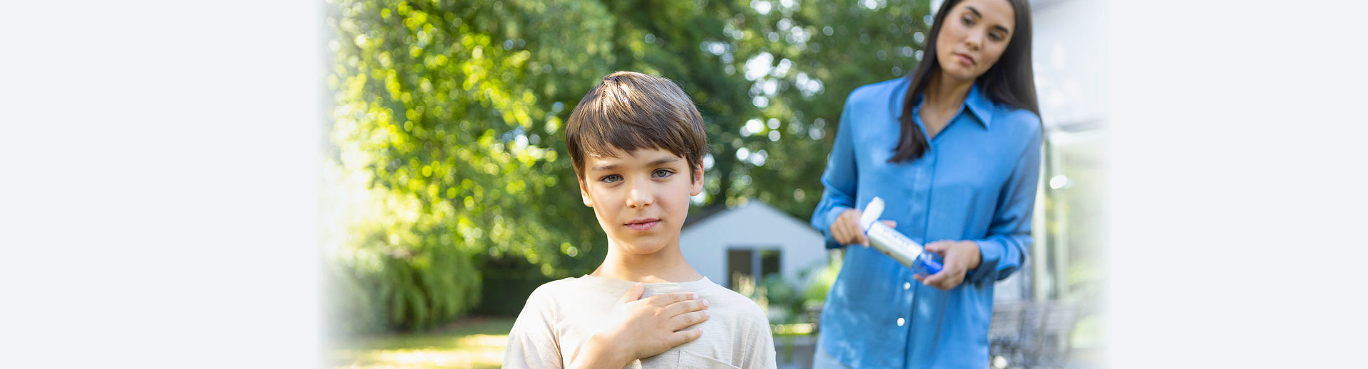 Child holds hand to chest while mother watches worriedly