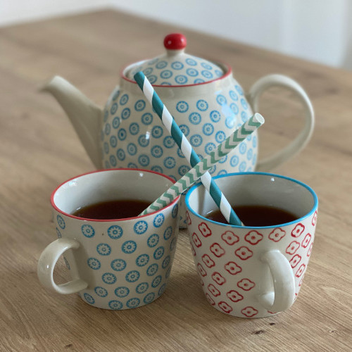 What can be done if a child has mucus in their throat: Drink plenty Jug and two cups with straws on the table