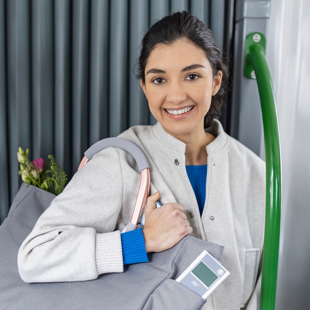 Young-Lady-wears-eBase-Controller-in-a-shoppingbag.jpg